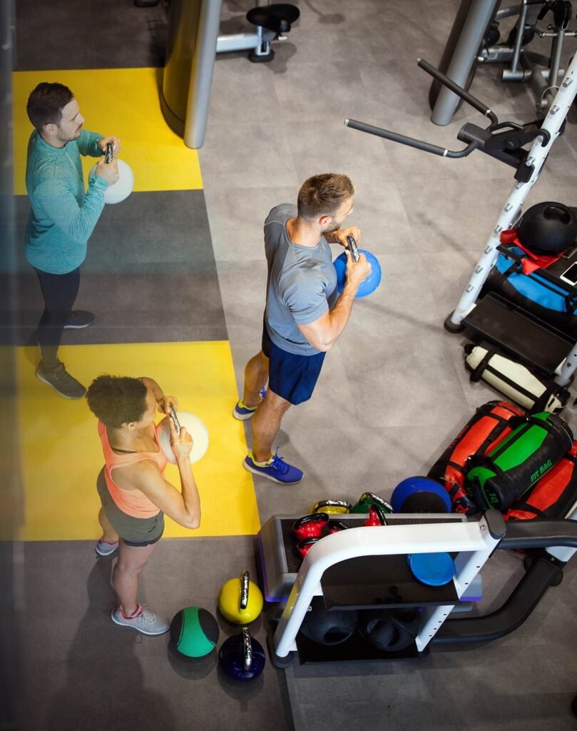 People exercising on colorful gym floor